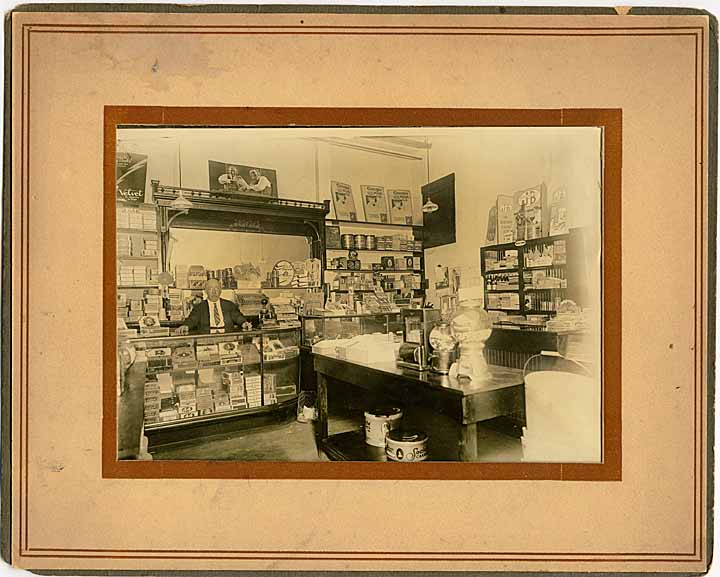 Elmer Plumb at the register of his cigar shop in Olympia