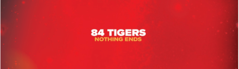 A blurry red spot with bright spots inside, sitting against a black background